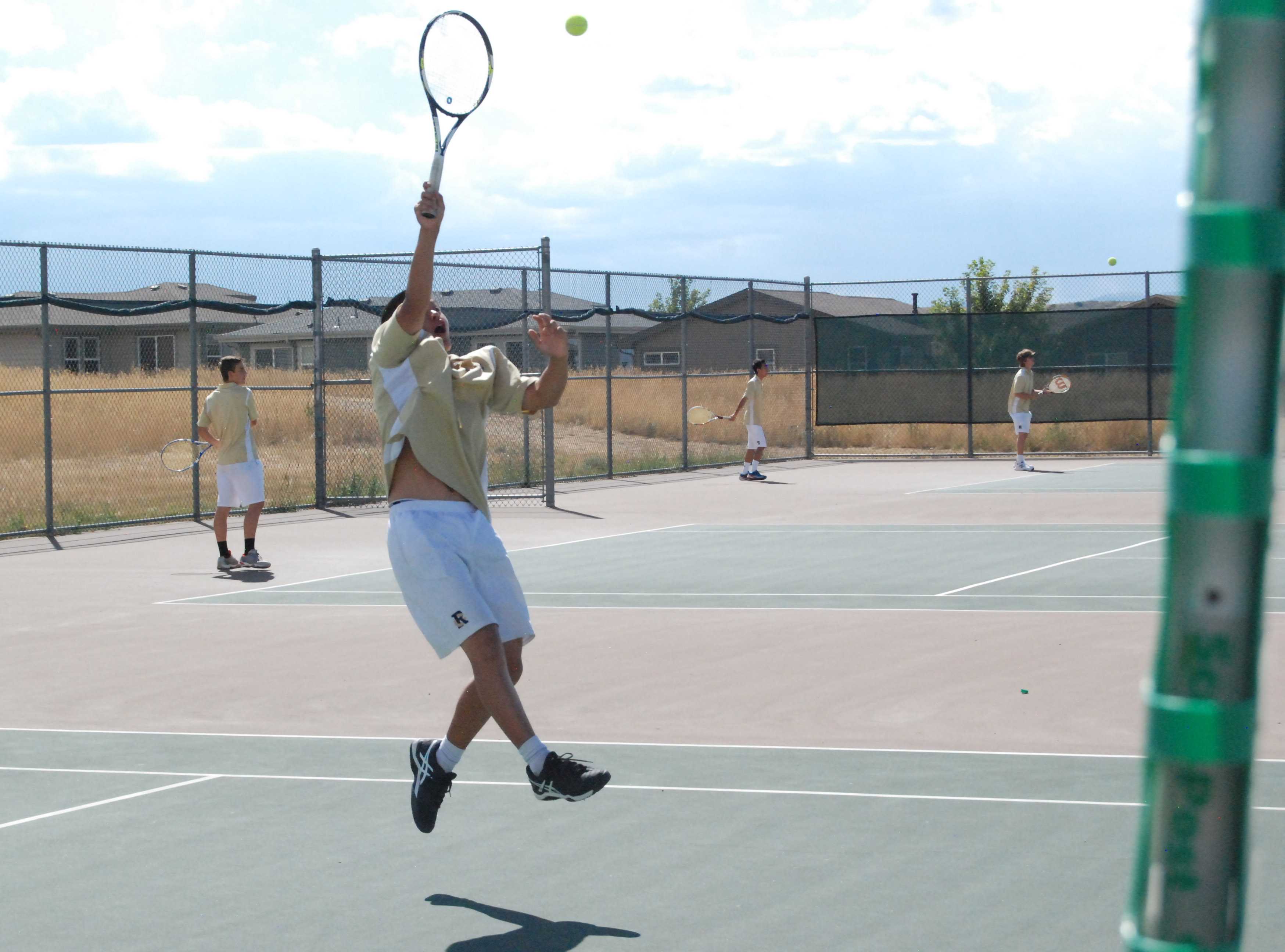 Will Kong '18 returns a volley during his match Tuesday against Mountain Vista. Will lost his match 6-4 6-4.