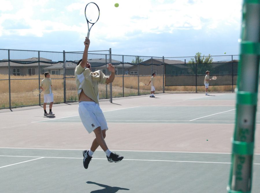 Will Kong 18 returns a volley during his match Tuesday against Mountain Vista. Will lost his match 6-4 6-4.