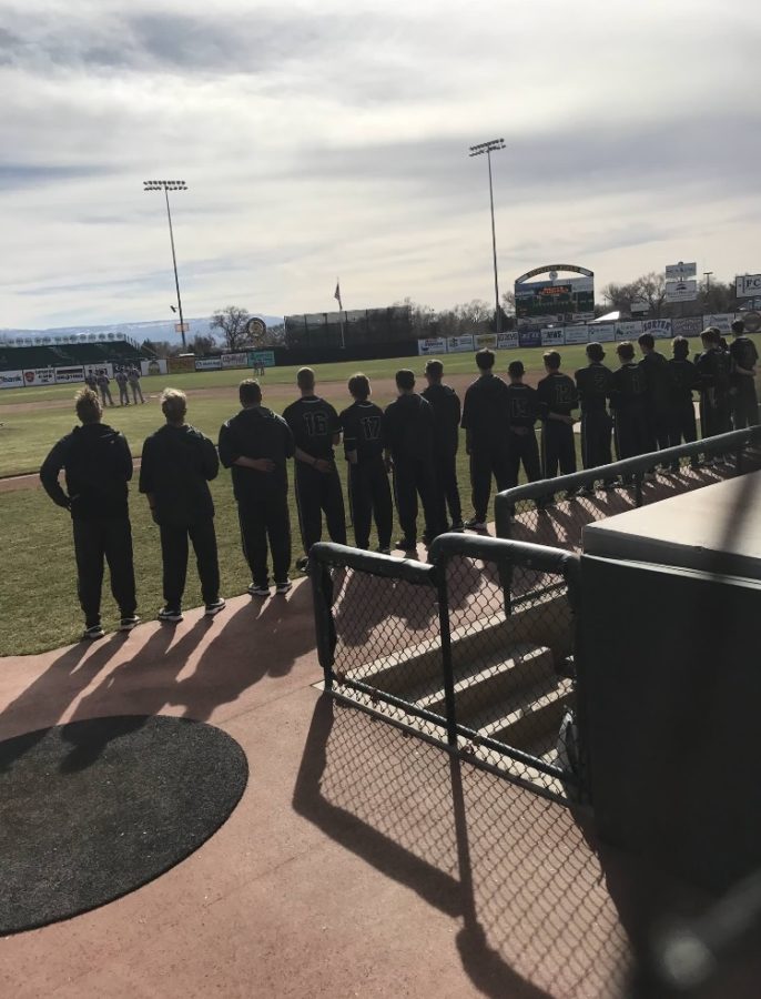 The team lines up for the National Anthem Thursday Mar. 9 against Fruita Monument. 