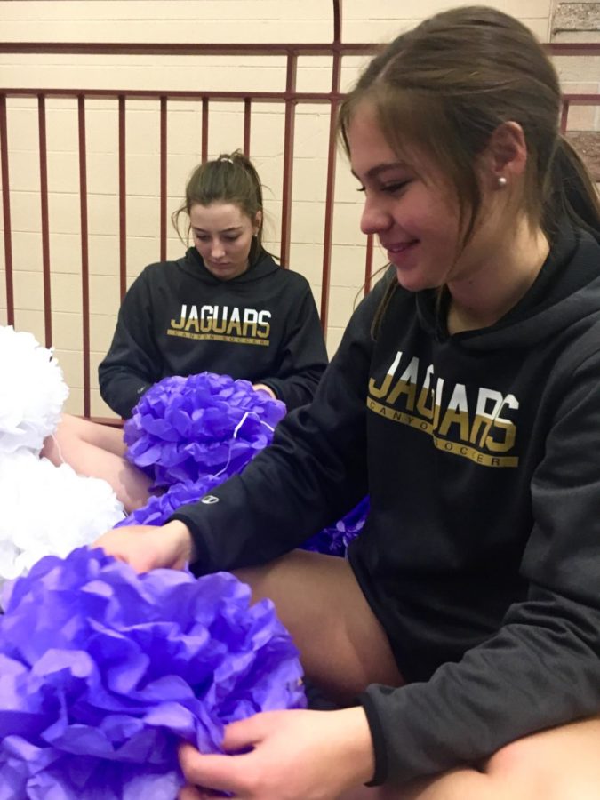 Emma Brieske ‘19 and Rachael Merrill ‘18 make tissue paper ball ornaments with STUCO in order to decorate the hallways for Wish Week, Thursday, March 1. PC: Emily Humes