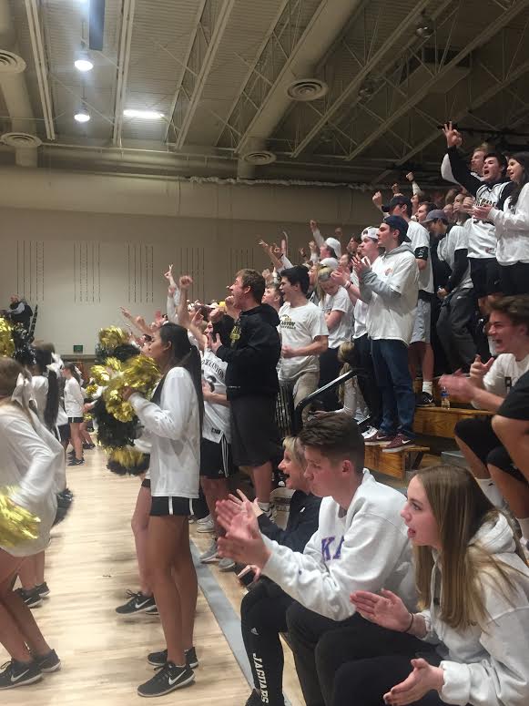 The student section anticipates a three pointer during the Wednesday night Sweet Sixteen game, Feb. 28, against Eaglecrest High School.  After a hard-fought game and one overtime, Rock Canyon boys varsity basketball won the game 65 to 64. (March 1, 2018)