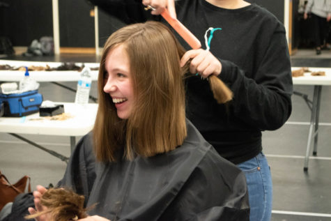 Julia McDonald 21 laughs after getting her hair cut during the Dare to Share event Tuesday, March 5. 102 pony tails were donated in four hours.