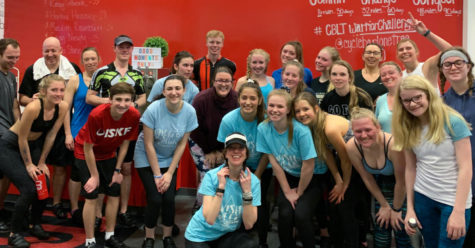 After attending a spin class at Cycle Bar Lone Tree, a collection of students and faculty pose outside the bike studio March 2. French National Honor Society sponsored the spin class as a way to raise money for Wish Week. Bikes were $25 a person and FNHS raised $550 from the 45-minute class.