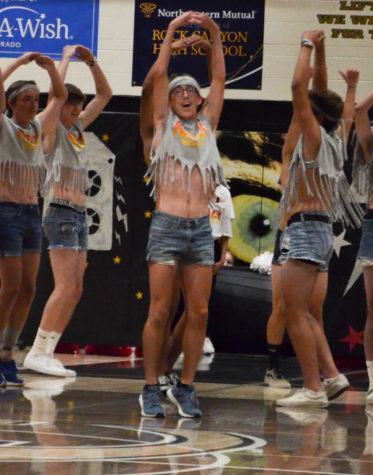 Derek Fearon 20 performs with the Man Poms during the homecoming assembly Sept. 19. 