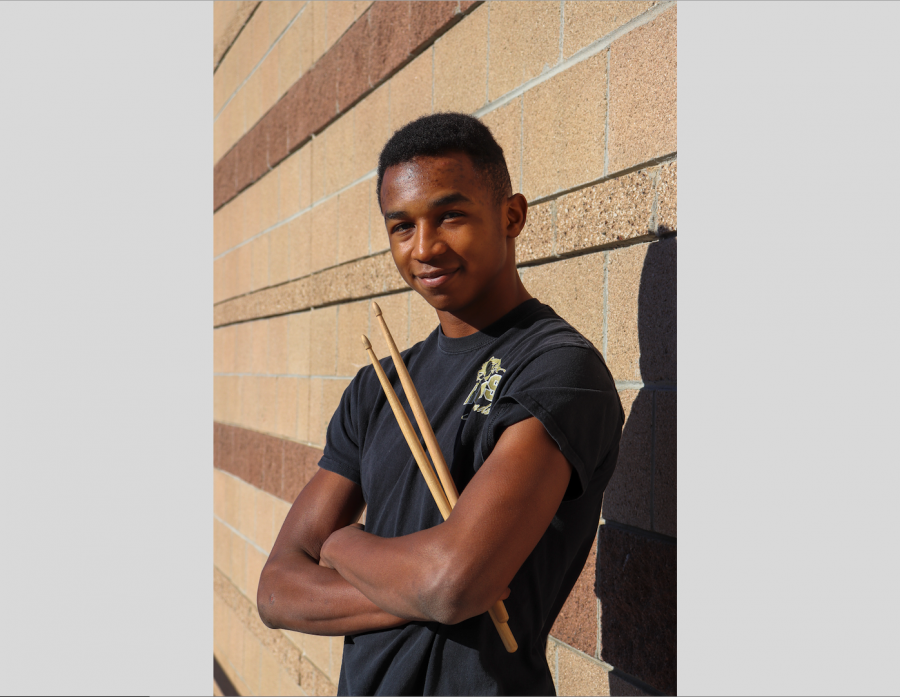 Jaden McGowan 22, an aspiring musician, and electronic music producer poses with his drumsticks.
