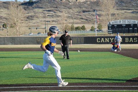 Brady Campbell 24 runs to first base as Carter Spielmann 22 slides to second base at Varsity home game April 2. The opposing team  hustled to get the ball but Campbell and Spielmann beat them to the bases.