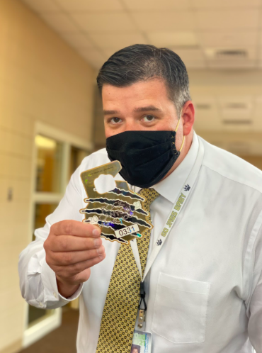 To show off the new parking pass design, Principal Andy Abner held up the new parking pass. Admin is aware of the packed nature of the student parking lot and feel for the students that are facing the challenge of finding a parking spot every morning.
“We hear you Jags, I really wish that whoever designed Rock Canyon high school would have designed it with enough parking space to accommodate all of our students,” Abner said.