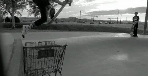 Kayden Ozdemir 24 jumps over a shopping cart at a local skate park. I skate just for fun but my favorite trick to do is probably the varial kickflip, Ozdemir said.
