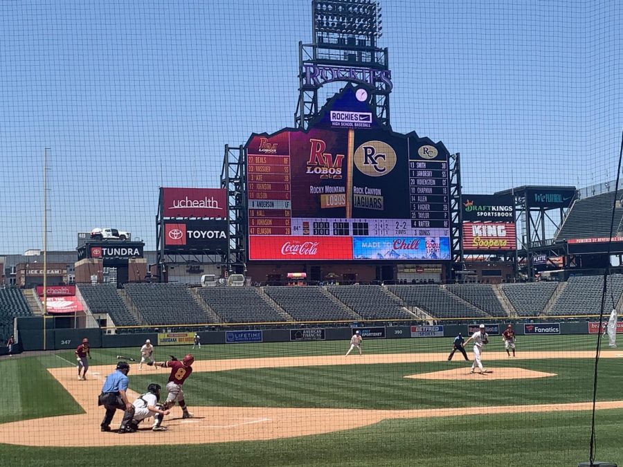 Catcher Dexter Wenger '22 crouches as the Varsity team reacts to a hit from the RMHS Lobos at Coors Field June 8. In the 5th inning, the game neared a tie and the tensions were heightened. 