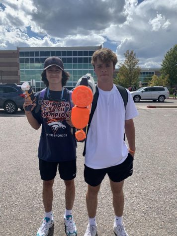 “Colten Martinez ‘22 and Carter Pollock ‘22 pose with their water guns in the Rock Canyon parking lot” PC Ben England.