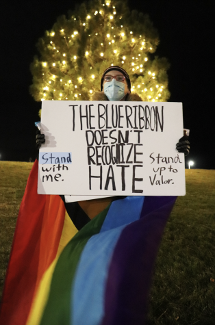 Gavin Moody ‘22 individually protests outside of Valor Christian
High School (VCHS) Nov. 21. Every day after
school, Moody takes a stand against VCHS’s
treatment of LGBTQ+ staff and students,
protesting their win of the prestigious Blue
Ribbon Award.