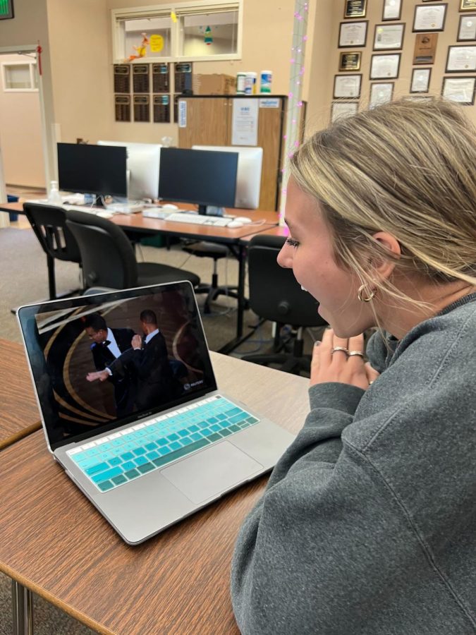 Gannon Figueroa ‘24 watches and reacts to the video of Will Smith getting on stage and hitting Chris Rock. The incident happened after Rock made a joke about Jada Pinkett Smith, Will Smith’s wife, which prompted Smith to get on stage and hit Rock. 