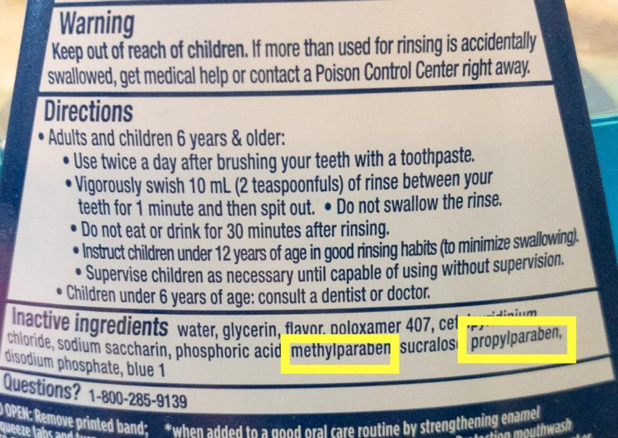 Two+ingredients+on+a+bottle+of+mouthwash+are+highlighted+to+show+the+prevalence+of+unhealthy+chemicals+in+self+care+products.