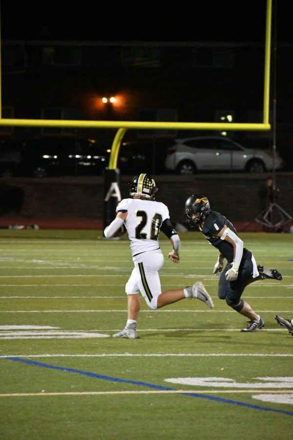 Running back Aidan Duda 23 has a long run, bringing the ball to the 37 yard line during the third quarter Sept. 23. Duda had a total of 157 yards throughout the game with an average of 5.8 yards a quarter. “The training I did during the summer [made me] faster and stronger, so when I take the ball for a long run it feels rewarding,” Duda said.