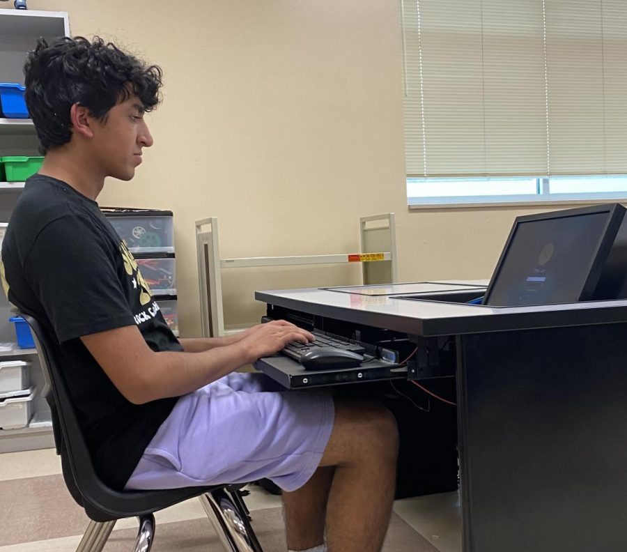 Sameer Arora ‘23 works on a computer in Chris Cassic’s classroom during access Sept. 22. Cassic teaches AP Computer Science Principles, AP Computer Science A, and engineering, which can qualify students for Computer Science Honor Society. “Students will be able to apply if they [are taking] a computer science class right now,” Arora said. “Well be advertising our honor society within the AP computer science classes.”
