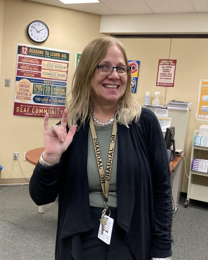 American Sign Language teacher Michelle Greene shows the sign for I love you. Greene became a teacher because of her love to share her culture and to meet new people. I like to teach, and I want to help people, Greene said, I want to see more people signing, and I like teaching to see people grow.
