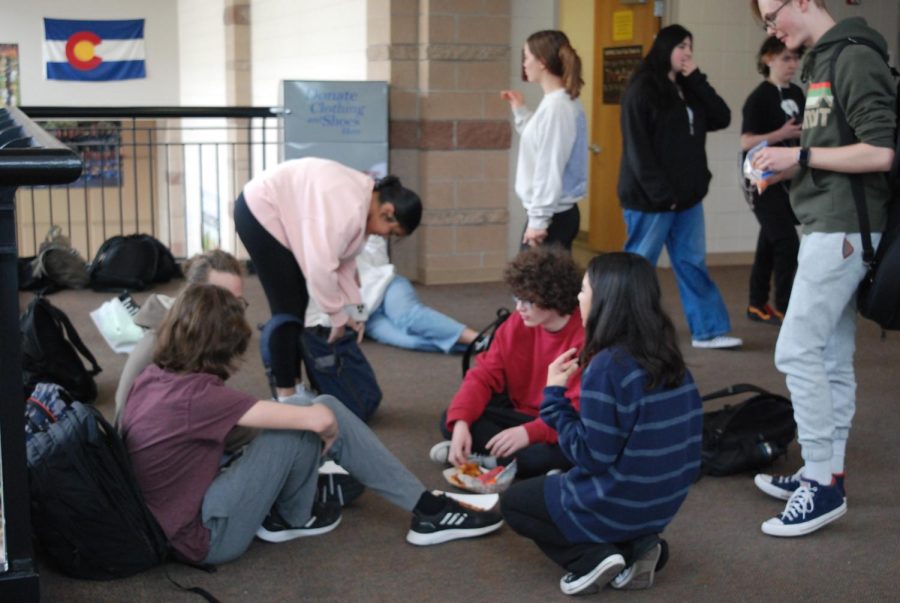 Students+sit+together+during+lunch+to+talk+to+each+other+Jan.+19.+After+two+weeks+of+winter+break%2C+they+began+to+all+eat+together+in+a+group+again.+%E2%80%9C%5BBeing+back+has%5D+been+great%2C+I+missed+seeing+my+friends+at+school+and+the+energy+from+them+is+great%2C%E2%80%9D+Keilani+Longwell+%E2%80%9825+said.+