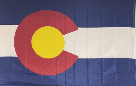 The Colorado state flag hangs in Pauls room Sept. 9, 2022. Before teaching, Paul worked as a police officer and a school resource officer at Heritage High School. “I really enjoy the interactions with this age group,” Paul said. 