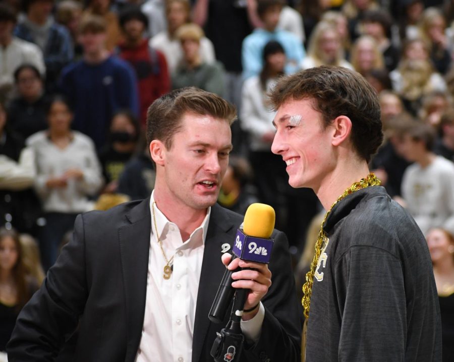 9News Sports Reporter Scotty Gange interviews varsity basketball guard Mac Terry 24 at the 9News Pep Rally Jan. 26. After Terrys buzzer-beater won the game against Regis Jesuit High School Jan. 20, the video clip of his shot was selected for 9Newss weekly high school sports segment, Honor Roll. It was a great team win and we got the job done at the end of the game, Terry said.