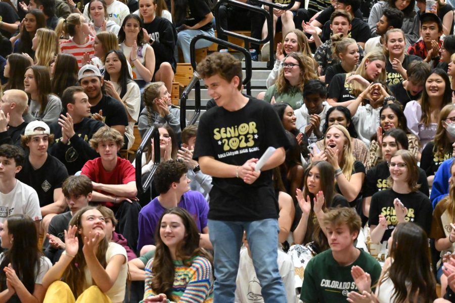 Smiling, Student Body President Myles Rubin ‘23 gives a speech in front of the senior section during the Moving Up Assembly May 12. Student Council wrapped up the year with a final speech, talking about school activities such as the Back to School Dance, Homecoming week, assemblies, Wish Week and Prom. “I love giving speeches at assemblies because of the roar of the crowd and the positive response from all of the students,” Rubin said. “It was awesome being Student Council President this year and being able to lead some of the best events that Rock Canyon has put together.”