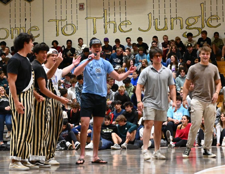 Newly-chosen Golden Boys Luke Fischer ‘24, Gavin Neira ‘24 and Andrew Southall ‘24 (left) stand next to former Golden Boys Ryder Bailey ‘23, Willis Browning ‘23 and Ryland Millz ‘23 (right) during the Moving Up Assembly May 12. They were chosen near the end of the year through an application process run by the previous Golden Boys as a part of their annual tradition to select student section leaders for assembly chants, athletic event spirit and more. “Being able to lead the student section and bring energy to every game was awesome,” Bailey said. “I loved having that leadership role.”