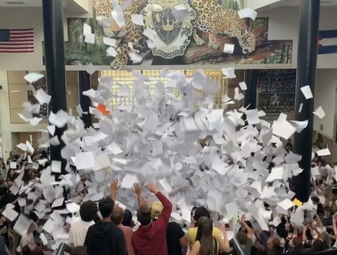 Papers fly in the air at the annual Senior Paper Toss May 9. The Paper Toss took place at 2:50 p.m. after finals for seniors ended.