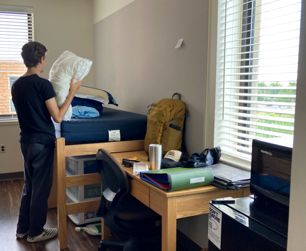 Connor Brown unpacks his belongings in his new college dorm room Aug. 22. Brown, among other graduates, started his first year of college in late August after graduating from Rock Canyon in May 2023.