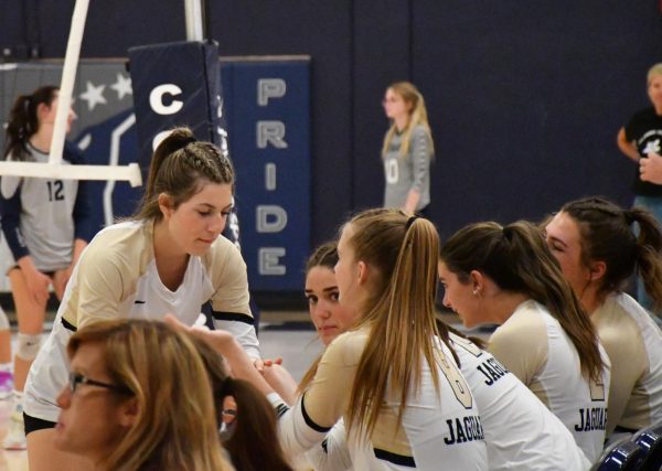 Morgan Buston ‘25 celebrates with teammate Addie Waller ‘24 in the varsity volleyball game at Columbine Sept. 7. The two players celebrated after both of them helped to assist a kill made by Alivia Eikenburg ‘25. The final score of the game was 3-0, with a score of 25-21 in the last set.