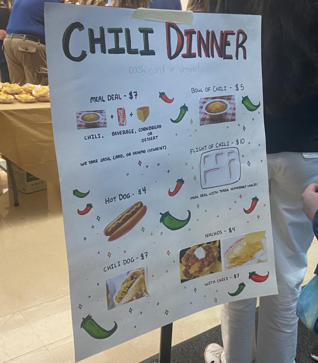Decorated with drawn-on chili peppers and sparkles, the Chili Dinner menu is displayed at the cafeteria entrance Sept. 21. The pictures of offered dishes included prices and deals.