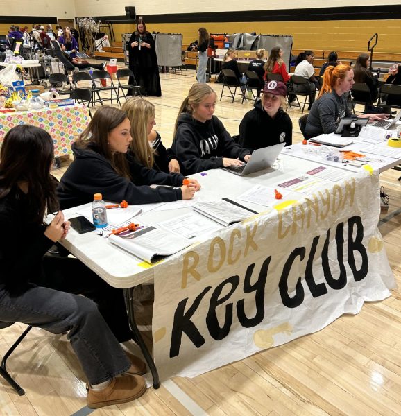 Hannah Cyril ‘25 waits with other students as they prepare for the Bloody Blood Drive in the gym Oct. 31. The Bloody Blood Drive was hosted by Key Club from 9:30 a.m. to 1:15 p.m. and collected a total of 52 units of blood, which was 13 units higher than what the club had anticipated. “I think it’s pretty important because it can save so many lives and it’s not really taking much from me,” Cyril said.