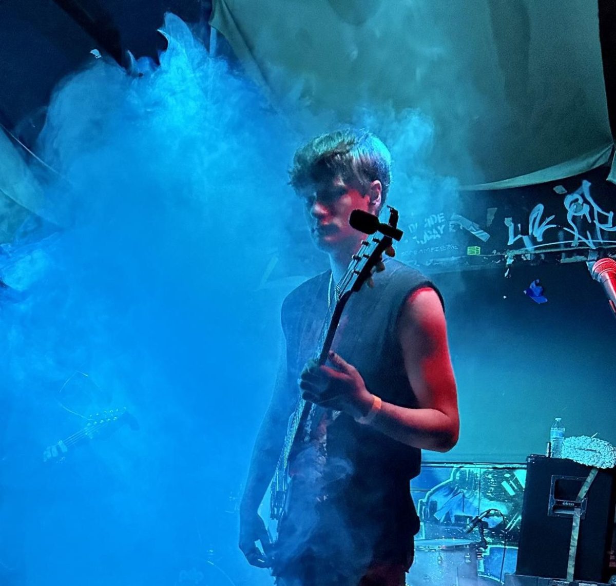 Dominik Dworak ‘24 plays his guitar near a fog machine at Seventh Circle Oct. 20. The name, Crypts of Golgotha, was created by their drummer, which they all agreed would be a good name for the band. “Our singer and guitarists name is Gabe, and I’ve known him since March of 2022. The drummer is his brother, Joaquin, and I’ve known him since last summer,” Dworak said.