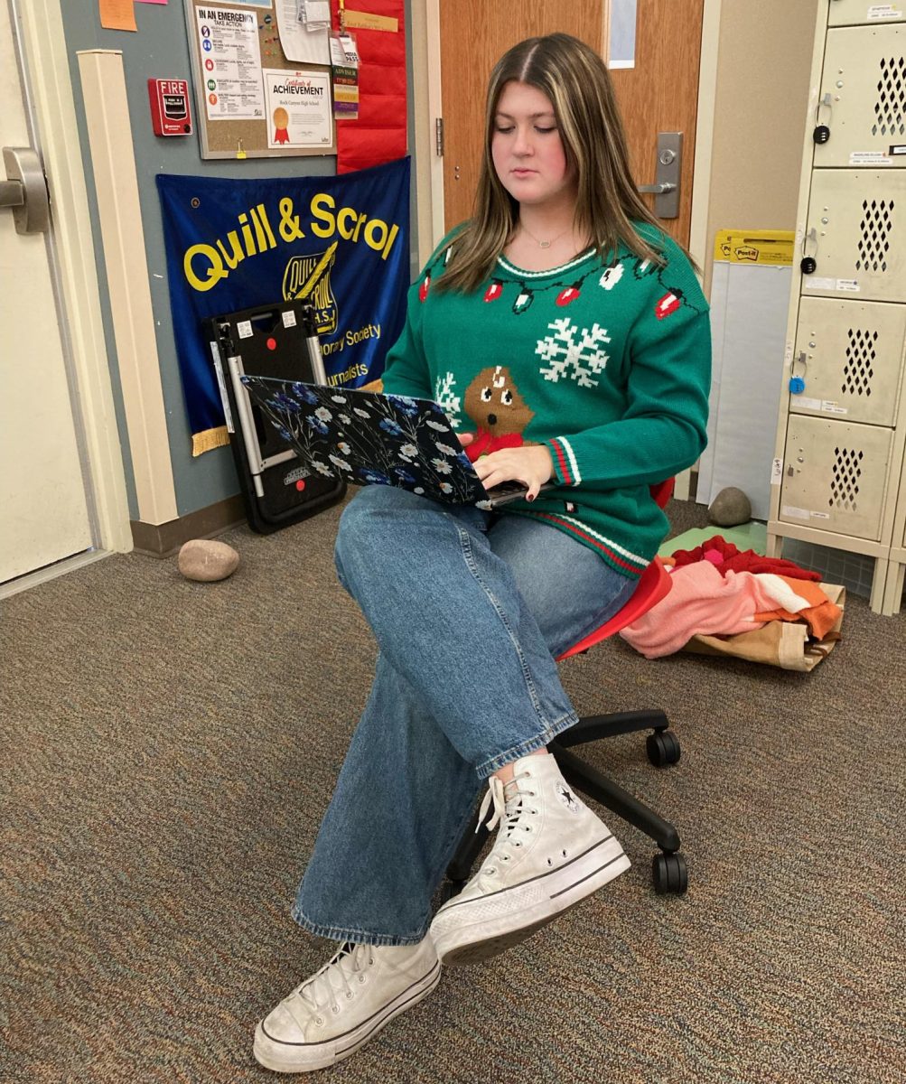 Claire Yeater ‘24 she studies for finals while wearing an ugly sweater Dec. 15. Yeater and other students wore ugly sweaters for the school’s spirit day to celebrate the last day of school before finals. “My mom bought an ugly sweater for a holiday party she had last weekend, and when I saw the Student Council post about Ugly Sweater Day, I had planned to wear the sweater she bought,” Yeater said. “I also think its fun to participate in spirit days, especially since its my senior year and I wont get the opportunity to participate in these kinds of things after I graduate. Im just trying to make the most of it. I dont know why people feel so embarrassed to participate in days like these.” Reporting by River Brown
