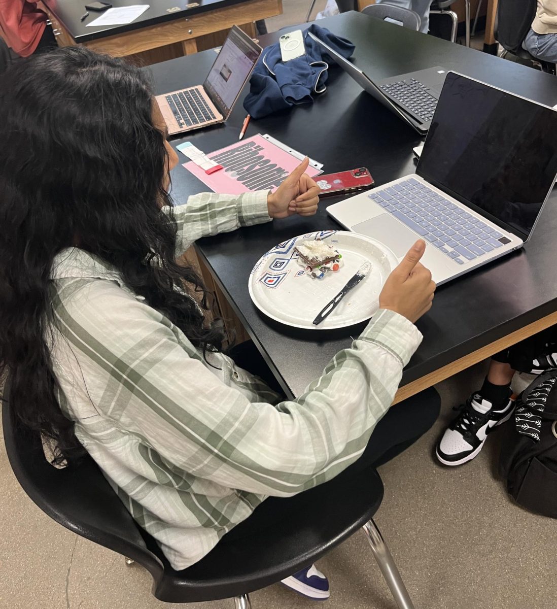 Ihita Kataru ‘26 assembles her candy sandwich in CTE Intro to Biotech Dec. 4. Students performed a lab in which they simulated making proteins by using different ingredients to build a candy sandwich. “I like that we got to learn and that we got to eat the candy at the same time,” Kataru said. 