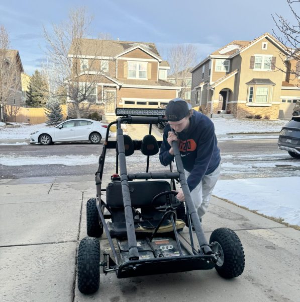 Dane Zitzlsperger ‘25 leans on the chassis of his go-kart to push it up his driveway Jan 8. According to FOX 31 Denver, Highlands Ranch received three and a half inches of snow. This allowed Zitzlsperger to spend his last day of winter break drifting his custom-built go-kart through fresh powder. “In the summers, I can’t really drift the kart since the tires can’t handle it, but in winter snow, it easily cranks donuts and long drifts,” Zitzlsperger said. 