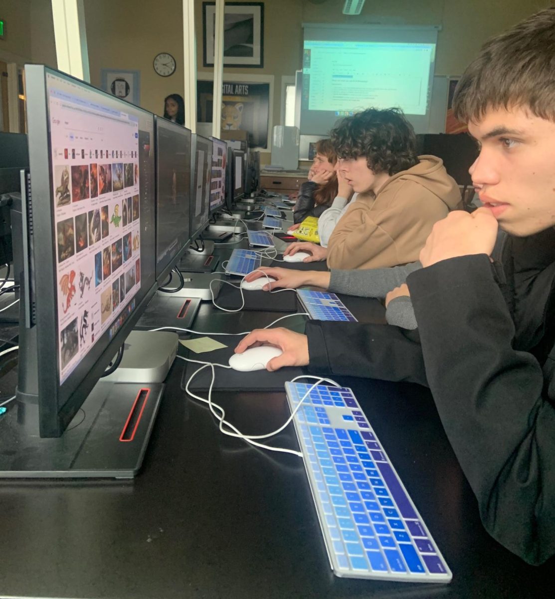 Kai Mcelderry ‘25 works on a piece in Kennetha Miller’s Photoshop and Digital Design class Jan. 11. Students were required to create a piece in Photoshop using already-created art and enhance it to be evaluated for their abilities. “I think it’s a pretty cool class,” Mcelderry said.