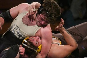 With his arm around his opponent’s head, varsity wrestling captain Ryan Banks ‘24 competes against a Thomas Jefferson High School wrestler at a home dual meet Jan. 31. Banks wrestled in the 215 weight class and lost 9-8. Before the dual, the team hosted Senior Night, where math teacher and sports commentator Brian Lamb announced the wrestlers’ post-graduation plans and shared their favorite memories from their wrestling careers. The meet ended with a final score of 48-21 L. “A moment that has made wrestling worth it to me this season is when I wrestled at Battle of the Ranch,” Banks said. “Going into the tournament, I had just moved up a weight class, so I wasn’t too sure how it would turn out. However, I ended up pinning two out of [the] three guys [that] I wrestled, and it felt like all [of] my work was finally coming together.”