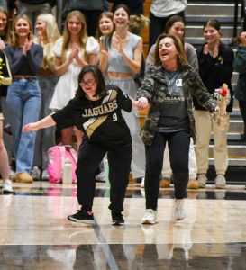 Chloe Bishop 25 pulls her mom across the court as as she is honored as a senior Feb. 6. Three seniors were recognized at the Unified game against the science department. Senior Night was sad and happy because weve gone through a lot together and have so many memories, Bishop said.