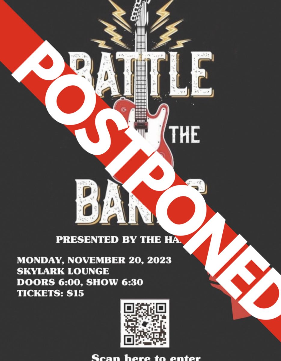 The graphic displays the Battle of the Bands advertising poster with a POSTPONED sign over it. The event was cancelled in November, with no specific future date announced.