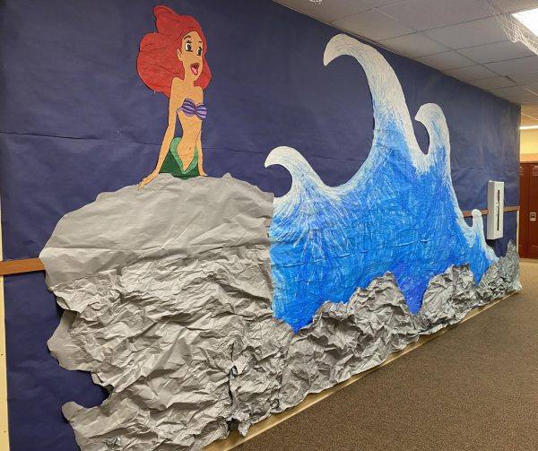 The paper display of Ariel from The Little Mermaid is hung on the wall March 4. Ariel was one of the six characters that line the 2000s pod.