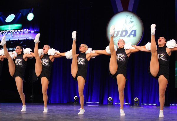 In a kickline, the varsity poms team competes in the Game-Day finals Feb. 3. The team competed in two other categories during Nationals: Small Pom, where they placed sixth, along with Small Jazz, where the team didn’t place. 