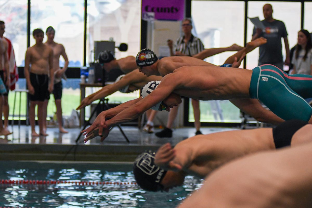 Varsity swimmer Maxxwell Menzies 24 dives into the water for the 50 yard-freestyle during the finals at A-Leaguges May 4. Menzies was a dual sport athelte this year competing in both the mens swim and dive program in the spring but also has partipated in the Sabercats combined hockey team over the winter.