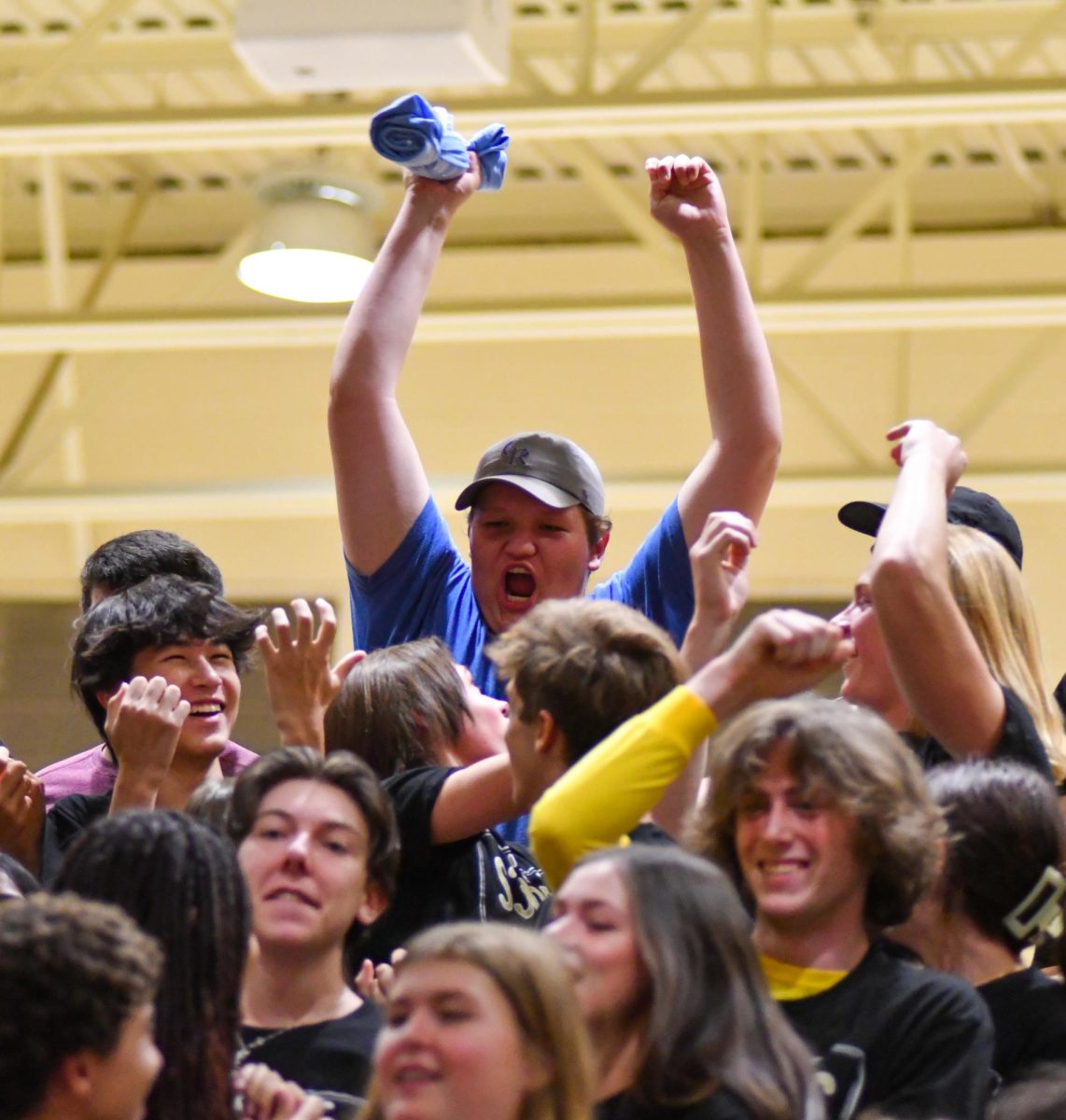 Karl Paulson ‘25 catches a t-shirt during the Back To School assembly Aug. 23. During the assembly the science department slingshot past Wish Week and Winter Week t-shirts into the crowds. “It was super fun to catch the shirt. It definitely shows school spirit and pride for the new year. It's definitely one of the key assemblies,” Paulson said.