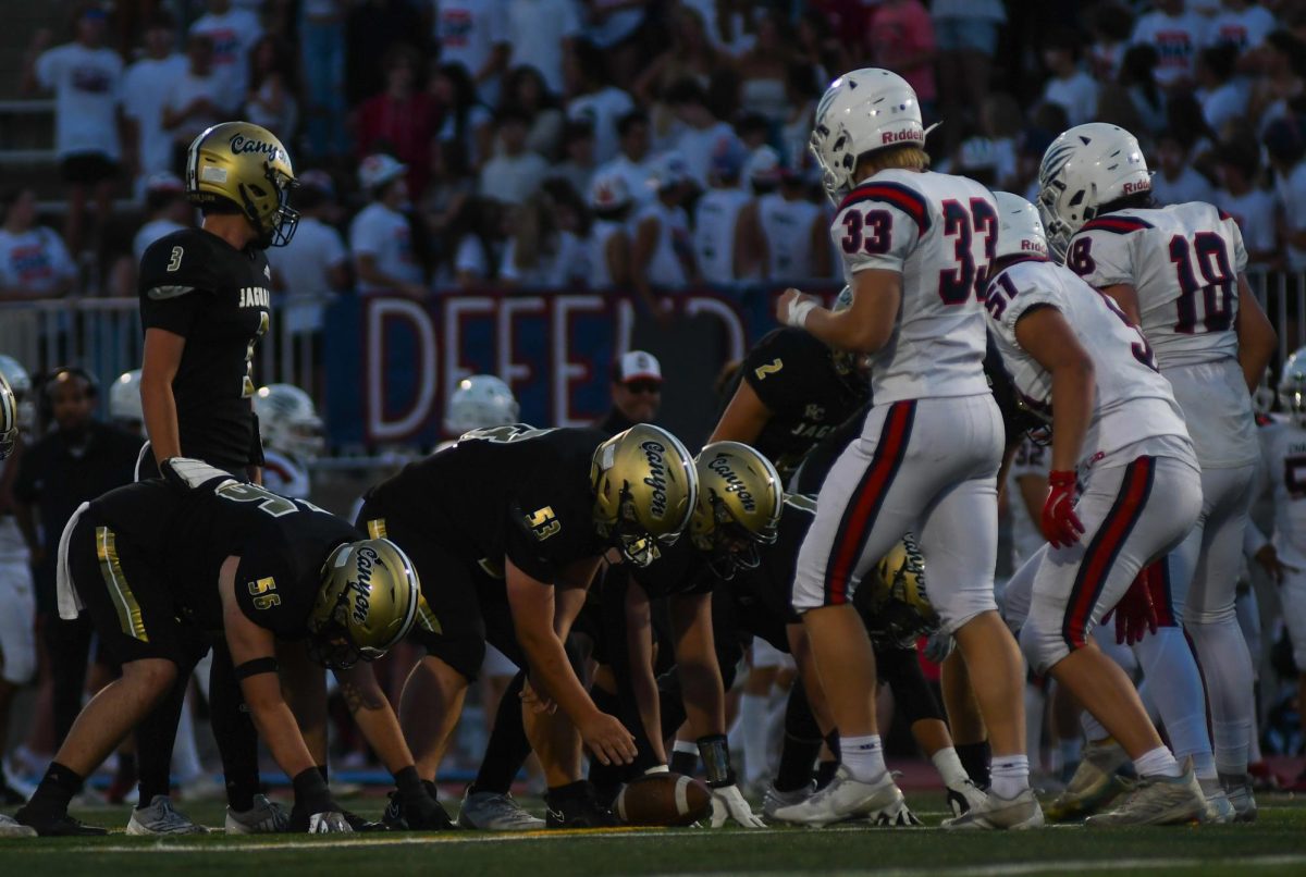 Varsity football offensive guard Preston Duman ‘26 and offensive tackle Brodyn Caruso ‘26 face off with Chaparral High School (CHS) Aug. 30 at Echo Park Stadium at 7 p.m. During the game, the team averaged 321 rushing yards according to MaxPreps. “During the game I felt lots of different emotions like the excitement of a home game. I also felt very exhausted cause I played for most of the game,” Duman said. 