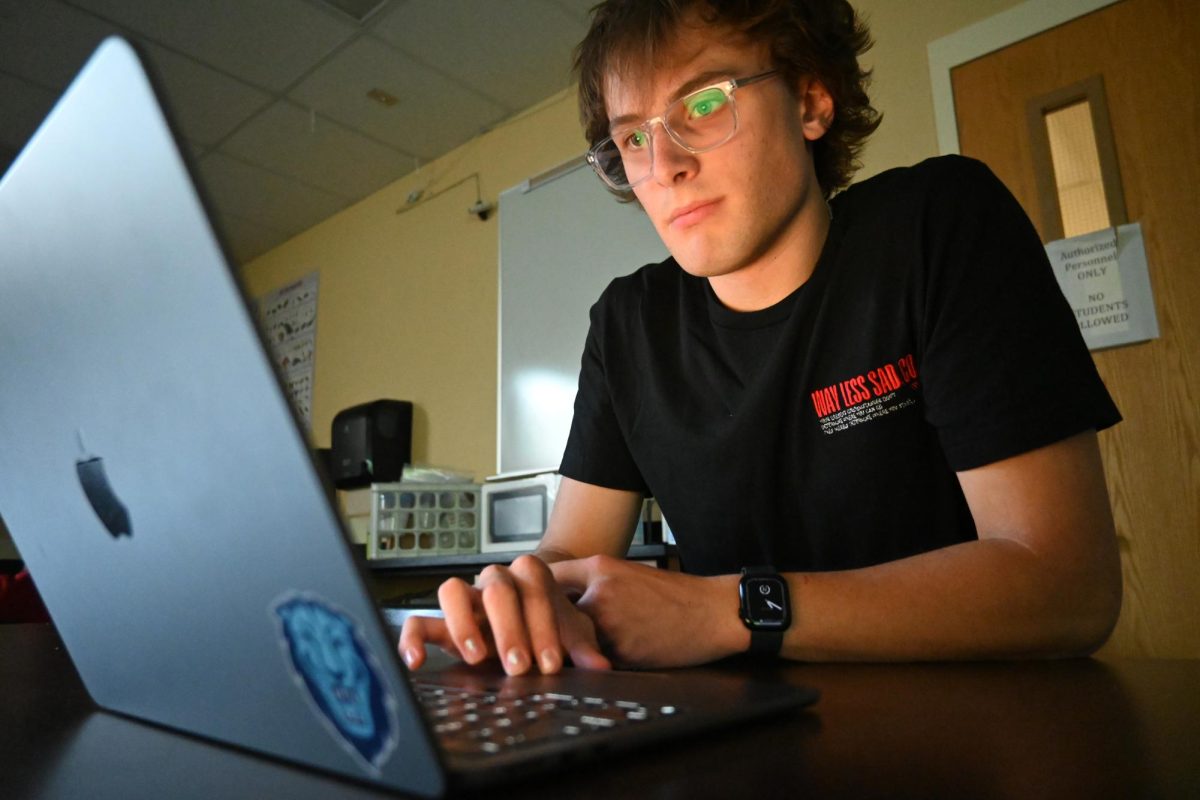 Nick TeSelle ‘25 works on the “WayLessSad” merch website Aug. 29. WayLessSad is aiming to collaborate with Better Help and make its own hotline to be there for those who need immediate help. “Eventually I'd like to have in-house psychiatrists and psychologists that you can talk to on call whenever you need,” TeSelle said. 
