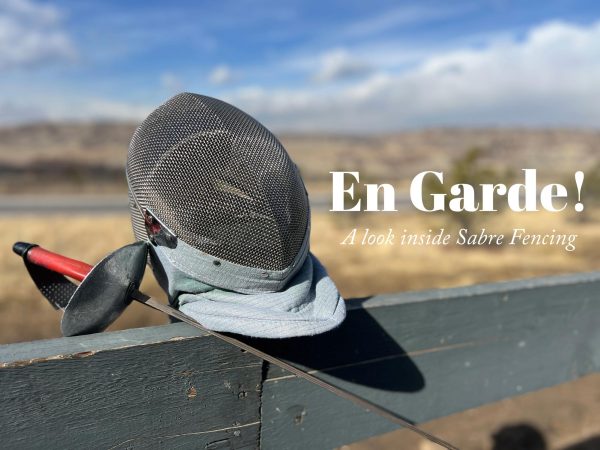 A fencing mask and Sabre sit on top of a fence. These two pieces of fencing equipment are the most recognizable to most people.