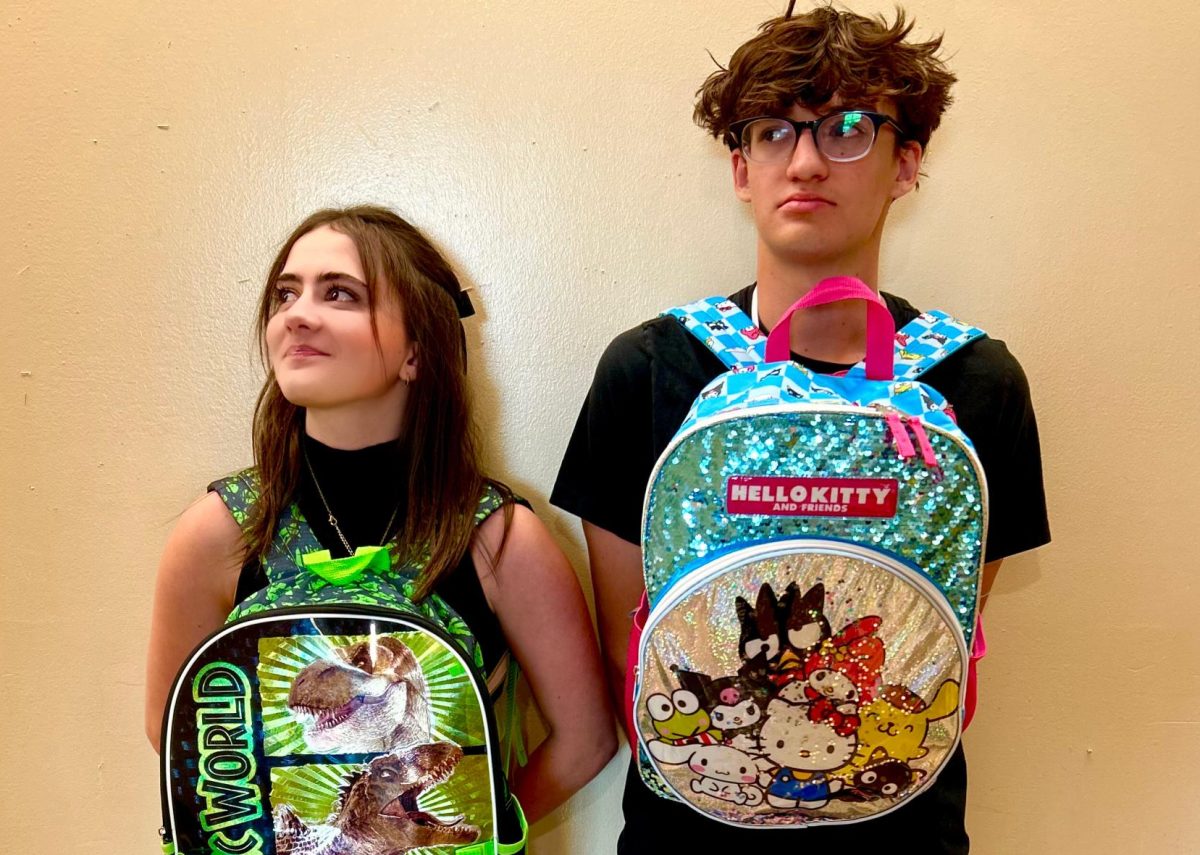 Ryan Whitham-O’Dell '26 and Emmerson Leddick '26 show off childhood favorites and friendship in Senior Studies. Their backpacks of choice are Jurassic Park and Hello Kitty.
