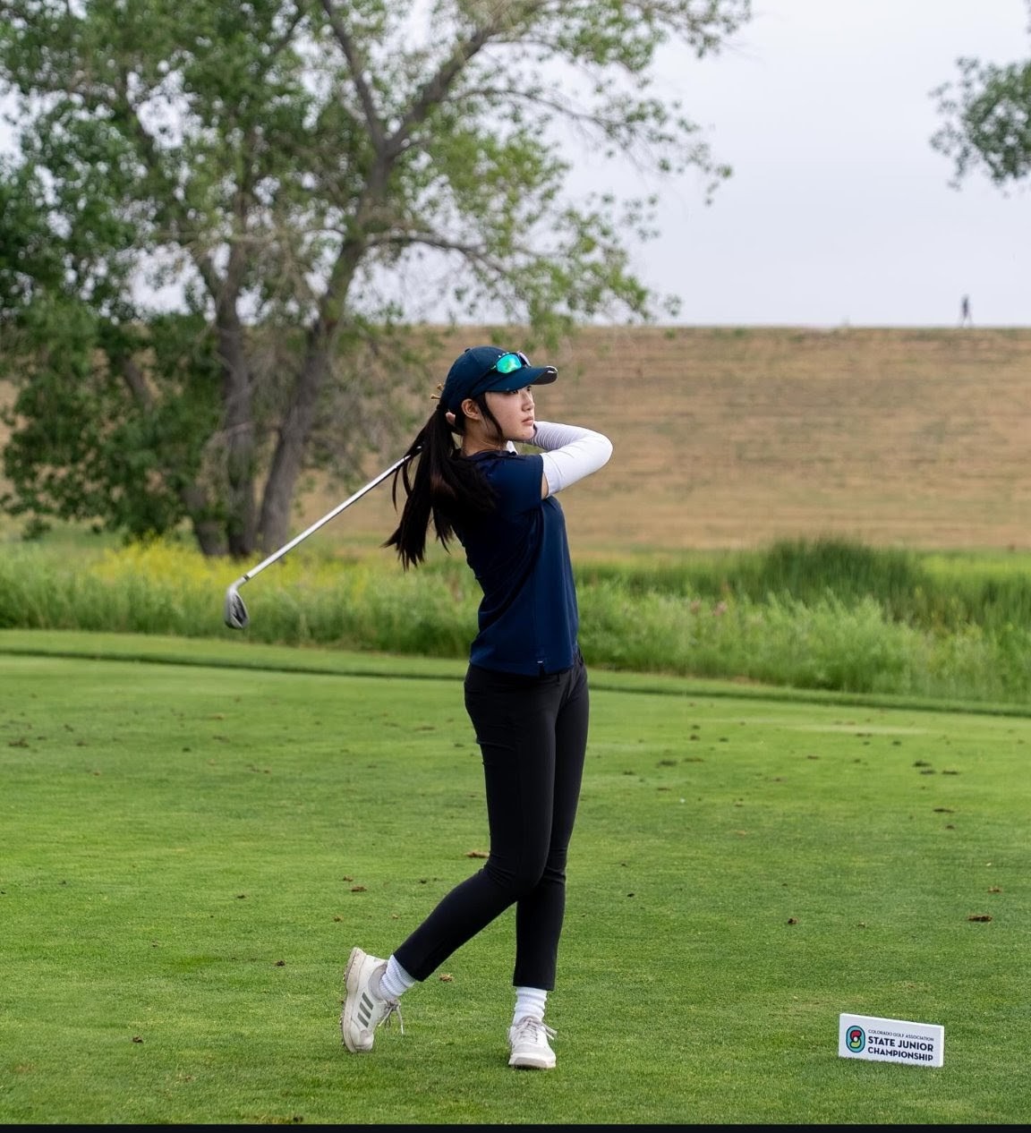 Ashley Chang ’26 competes in the Colorado Golf Association State Junior Championship June 25 at the Common Golf Course in Aurora. She went on to win the entire championship. (Media by courtesy of Ashley Chang)