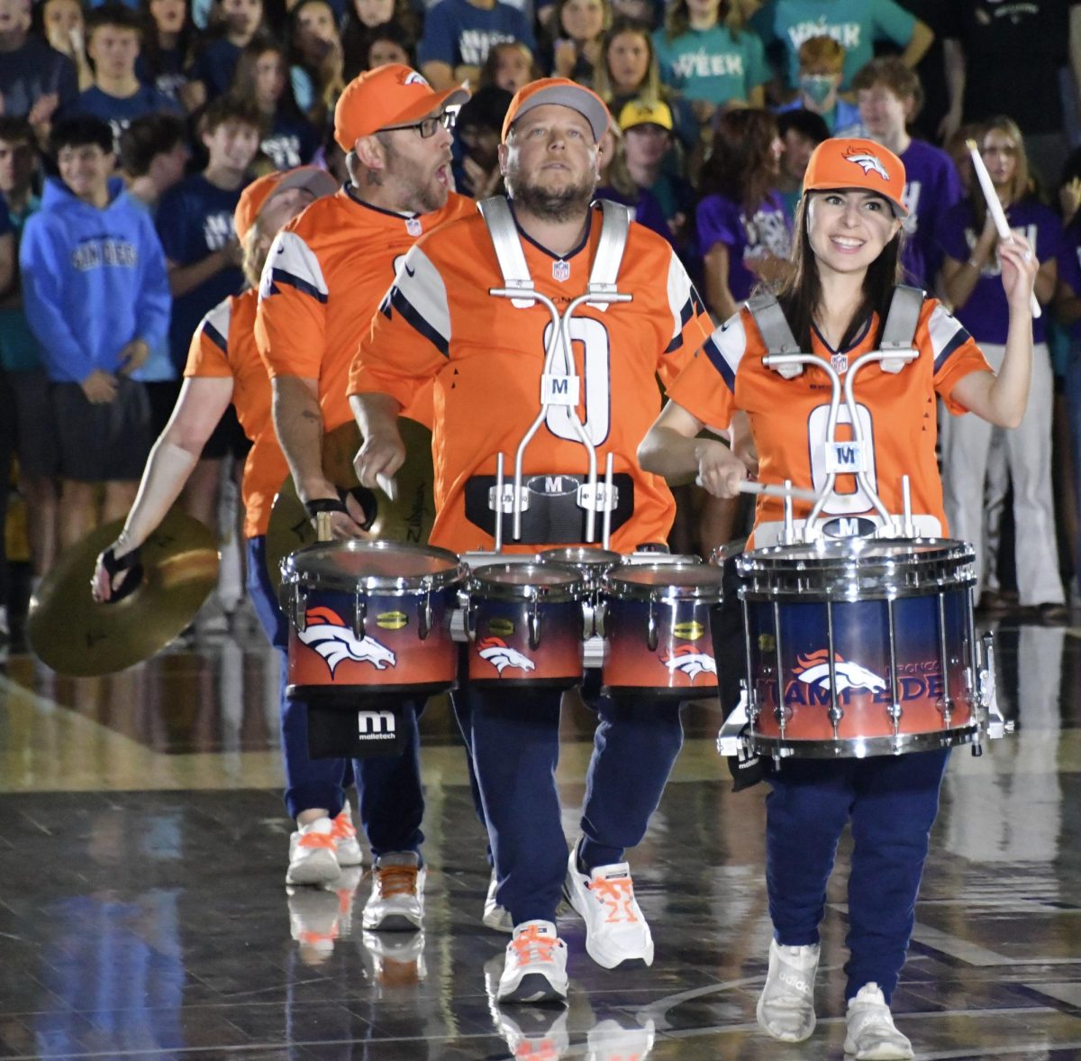 The Broncos drum line performs for the stands to commence the opening assembly.